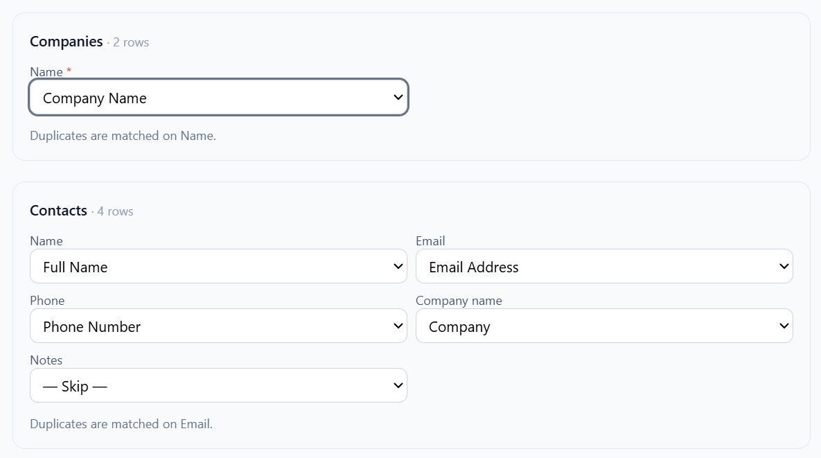 The column mapping screen for a CSV import. For Companies and Contacts, each FyneDesk field has a dropdown matched to a column from the uploaded spreadsheet, with unneeded fields set to Skip. Helper text notes duplicates are matched on Name and on Email.