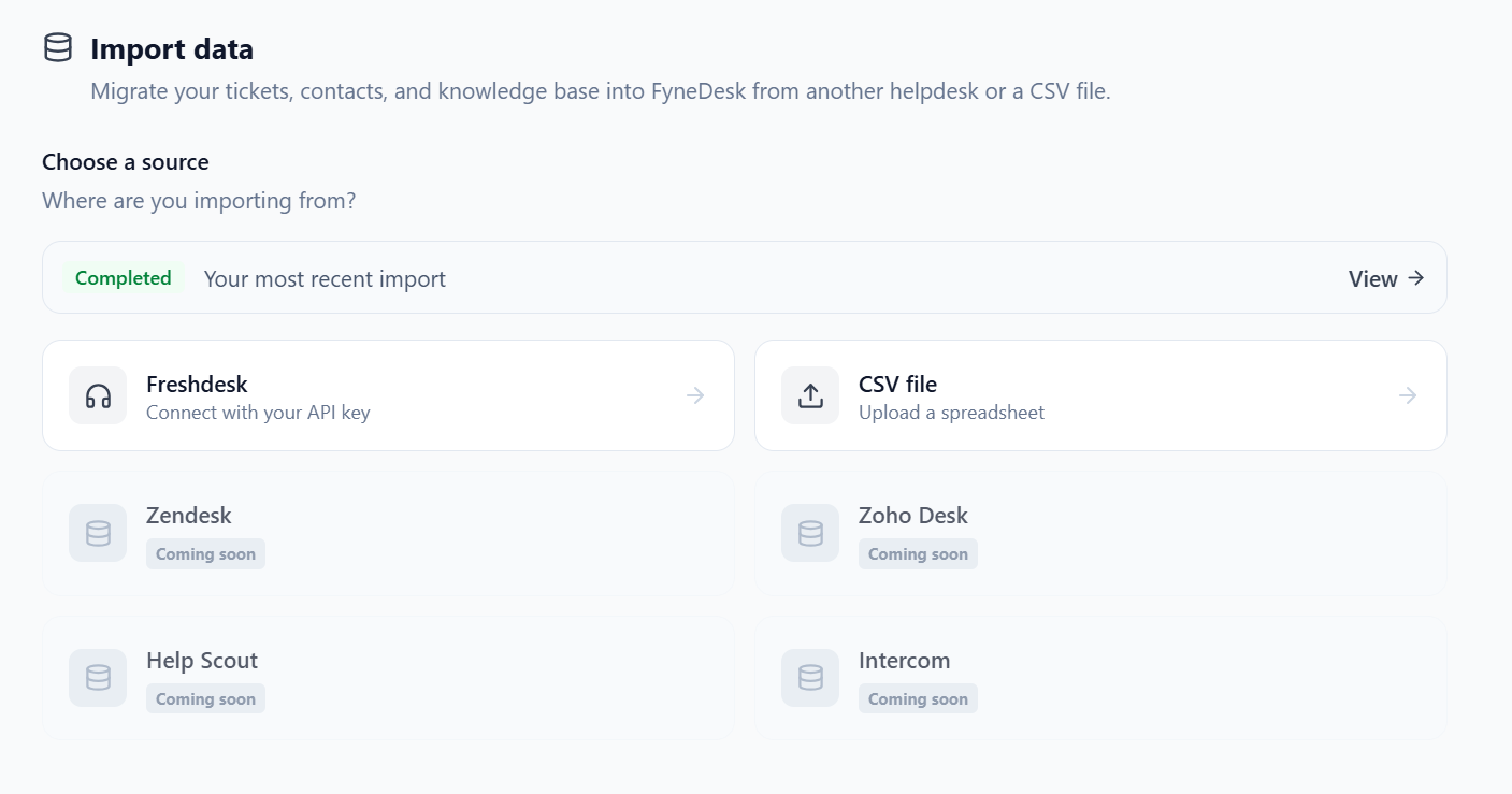 The Import data screen with the Choose a source step. Freshdesk (Connect with your API key) and CSV file (Upload a spreadsheet) are available, while Zendesk, Zoho Desk, Help Scout, and Intercom are shown greyed out with a Coming soon label. A banner at the top links to your most recent completed import.